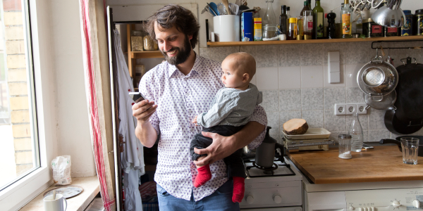 Man on phone with baby