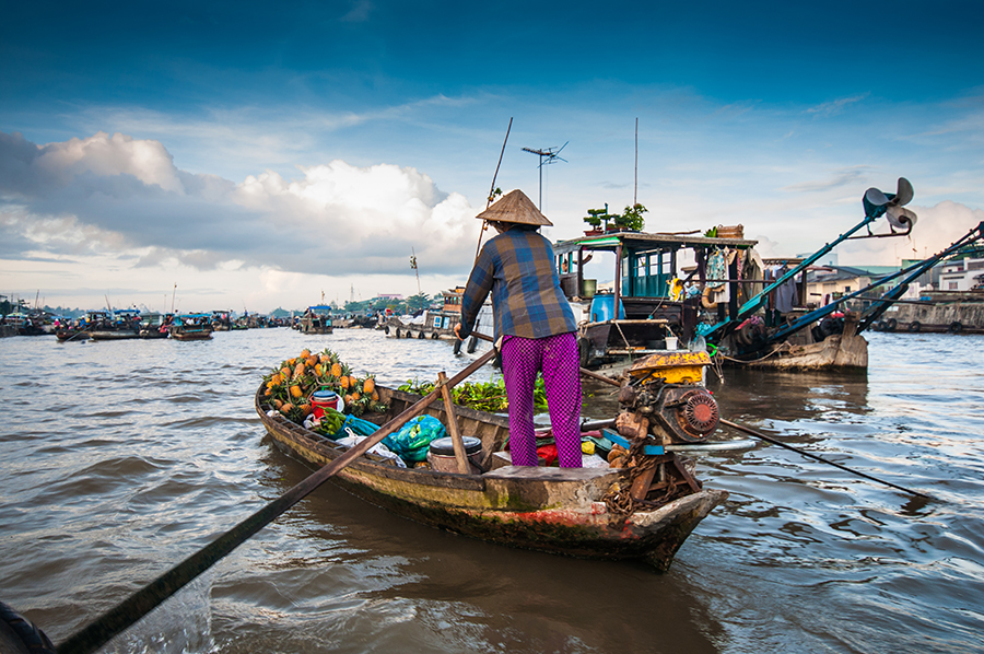 Local in boat on water Local in boat on water