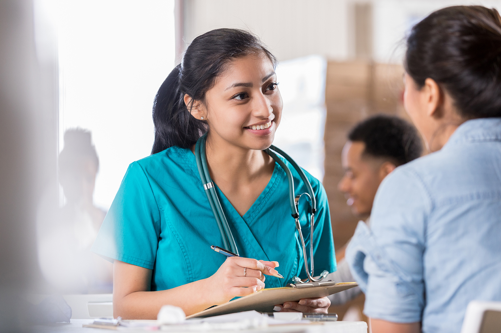 Doctor checking pulse on patient Doctor checking pulse on patient